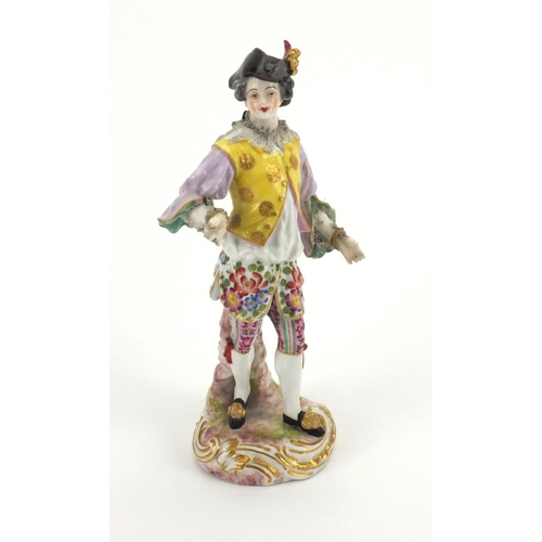 659 - Continental hand painted porcelain figure of a Dandy, blue cross sword marks to the base, 23cm high