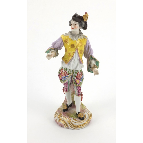 659 - Continental hand painted porcelain figure of a Dandy, blue cross sword marks to the base, 23cm high