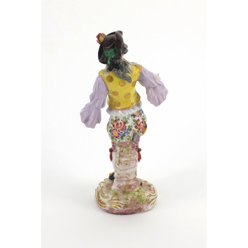 659 - Continental hand painted porcelain figure of a Dandy, blue cross sword marks to the base, 23cm high