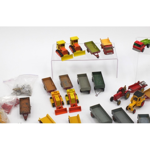 404 - Predominantly Corgi, Matchbox and Dinky agricultural vehicles and farm yard accessories including tr... 