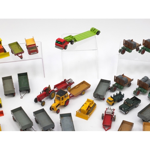 404 - Predominantly Corgi, Matchbox and Dinky agricultural vehicles and farm yard accessories including tr... 