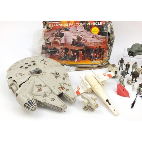 384 - 1970's and later Star Wars toys including figures and a Millennium vehicle with box