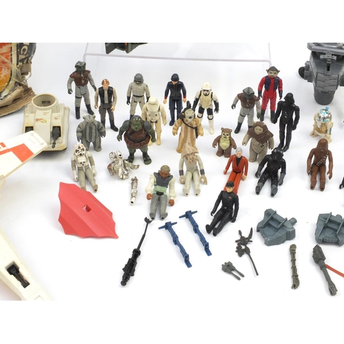 384 - 1970's and later Star Wars toys including figures and a Millennium vehicle with box