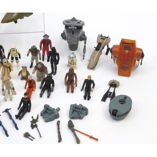 384 - 1970's and later Star Wars toys including figures and a Millennium vehicle with box