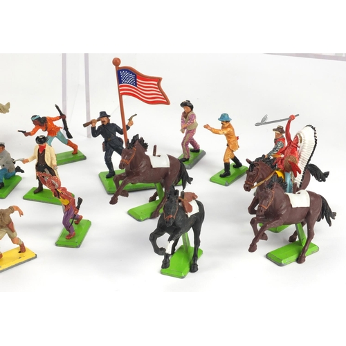 386 - Britain's plastic cowboys, Indians, horses and accessories, some with bases