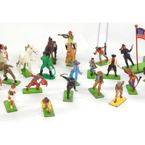 386 - Britain's plastic cowboys, Indians, horses and accessories, some with bases