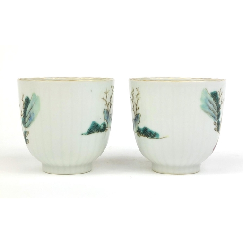 478 - Pair of Chinese porcelain tea cups, hand painted in the famille rose palette with court figures play... 