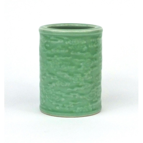 519 - Chinese celadon glazed cylindrical brush pot, decorated in low relief with a continuous band of clou... 