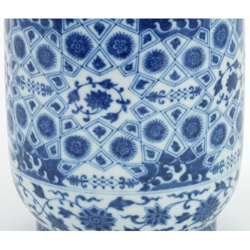 492 - Chinese blue and white porcelain cylindrical vase, hand painted with flowers, 23cm high