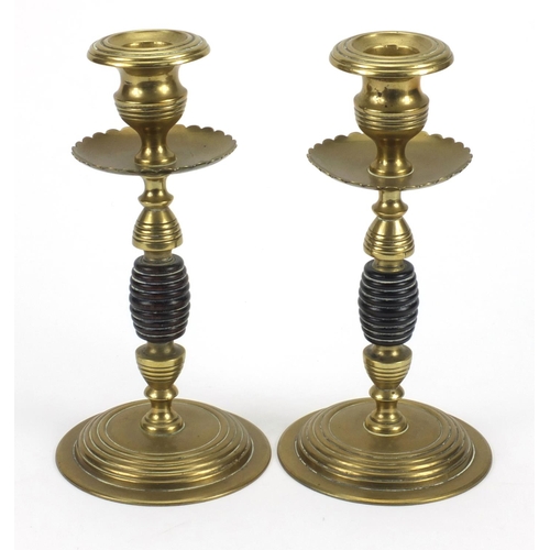 790 - Pair of aesthetic brass and wooden candle sticks, 19cm high