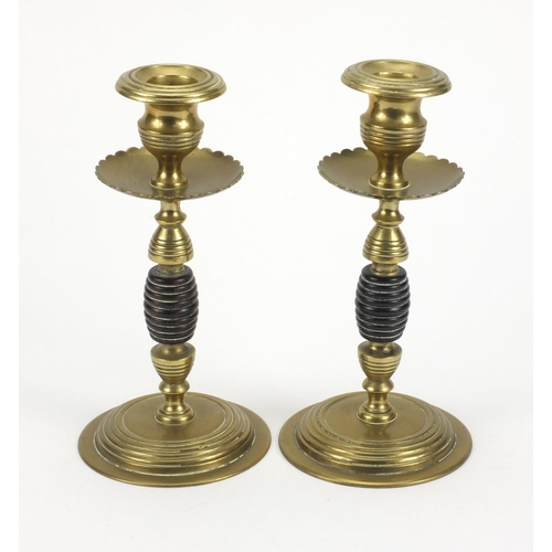 790 - Pair of aesthetic brass and wooden candle sticks, 19cm high