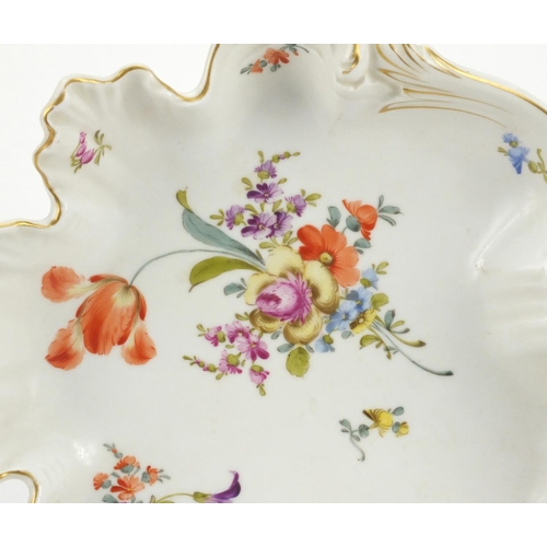 666 - Continental porcelain leaf shaped dish hand painted with flowers, factory marks to the base, 27cm wi... 