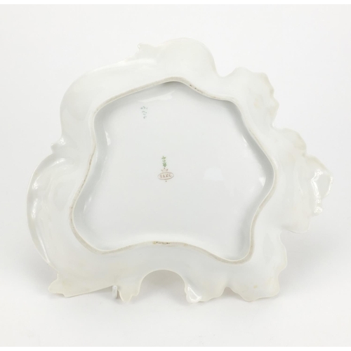 666 - Continental porcelain leaf shaped dish hand painted with flowers, factory marks to the base, 27cm wi... 