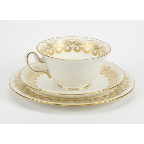 742 - Wedgwood gold Persephone pattern trio, designed by Eric Ravilious, factory marks to the base of each... 