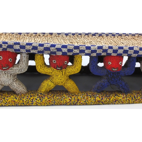 633 - 19th century Tribal interest Bamileke Cowrie shell and beadwork bed, 168cm in length