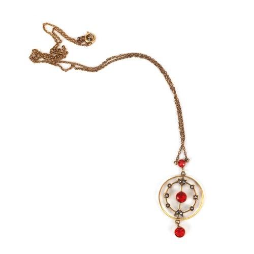 923 - Art Nouveau 9ct gold red stone and seed pearl pendant on 9ct gold necklace, the pendant 4cm long, ap... 