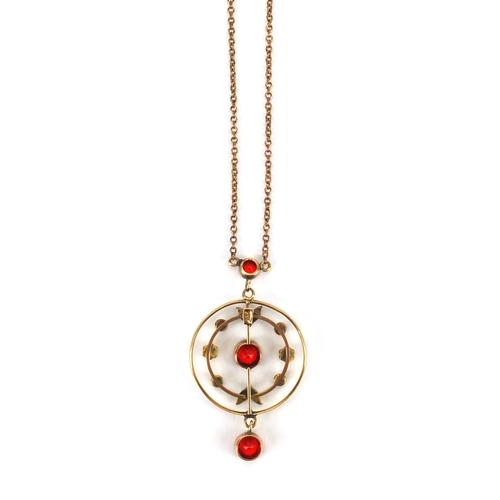 923 - Art Nouveau 9ct gold red stone and seed pearl pendant on 9ct gold necklace, the pendant 4cm long, ap... 