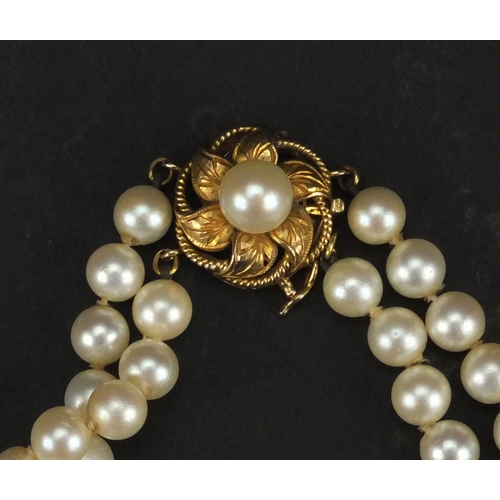 939 - Two string cultured pearl necklace with 14ct gold clasp, 38cm long, approximate weight 44.6g