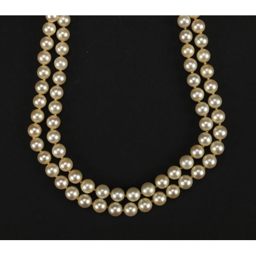 939 - Two string cultured pearl necklace with 14ct gold clasp, 38cm long, approximate weight 44.6g