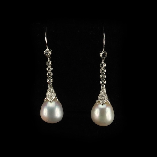 900 - Pair of 18ct white gold pearl and diamond drop earrings, 4.5cm long, approximate weight 9.4g