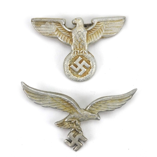 291 - Four German Military interest cap badges