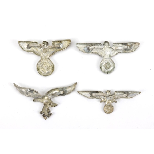 291 - Four German Military interest cap badges