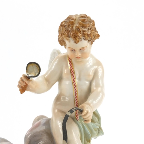 652 - 19th century Meissen porcelain model of a winged cupid on a triangular base, 'Je Le Dompte' , blue c... 