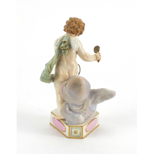 652 - 19th century Meissen porcelain model of a winged cupid on a triangular base, 'Je Le Dompte' , blue c... 