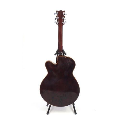 2853 - 1970/80's Korean made wooden acoustic guitar, with Mother of Pearl inlay and hand painted with a ros... 