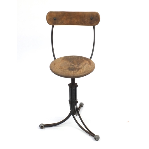 2085 - Industrial design three footed rotating stool, 79cm high