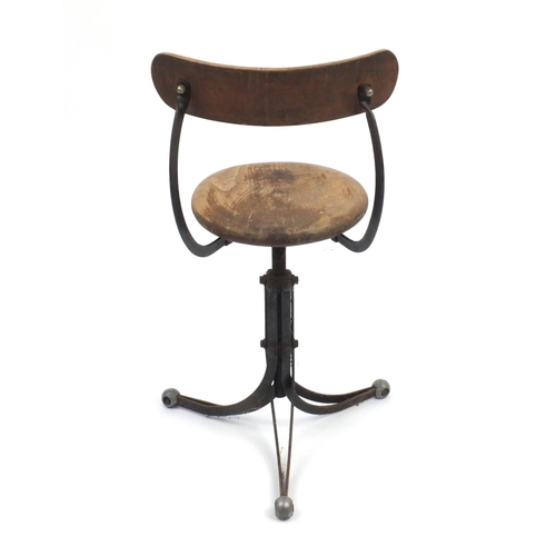 2085 - Industrial design three footed rotating stool, 79cm high