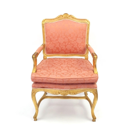 2026 - Gilt wood fauteuil, the toprail with carved shell motif, pink floral upholstery, 103cm high