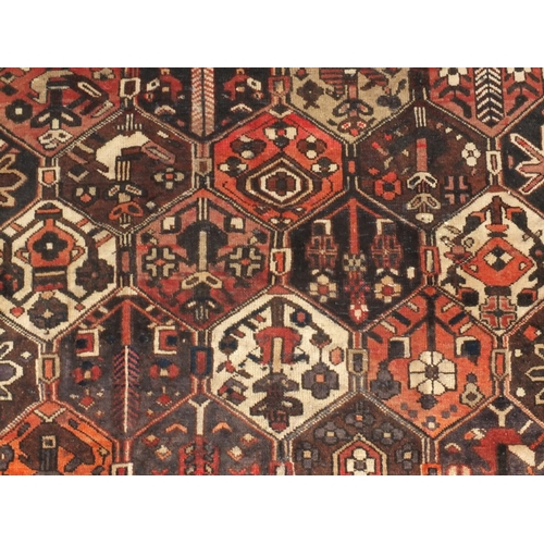 2051 - Rectangular Persian Azarbaijan rug, the central field and borders having all over floral motifs onto... 
