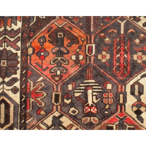 2051 - Rectangular Persian Azarbaijan rug, the central field and borders having all over floral motifs onto... 