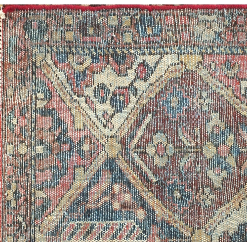 2039 - Rectangular Persian bakhtiari rug, the central field having all over floral motifs with cream girdle... 