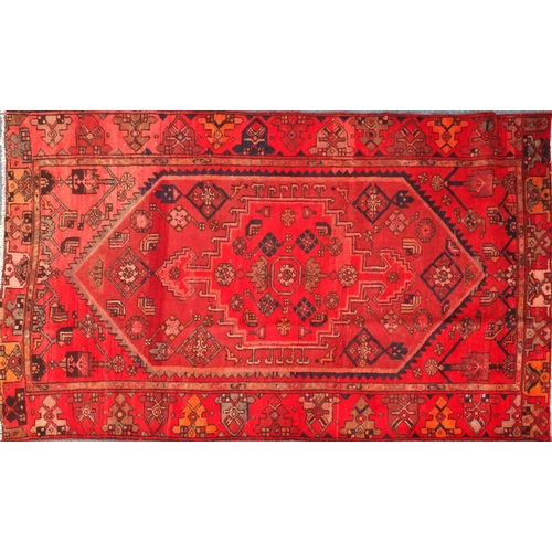 2067 - Rectangular Persian Hamadan rug, the central field and borders having all over floral motifs onto a ... 