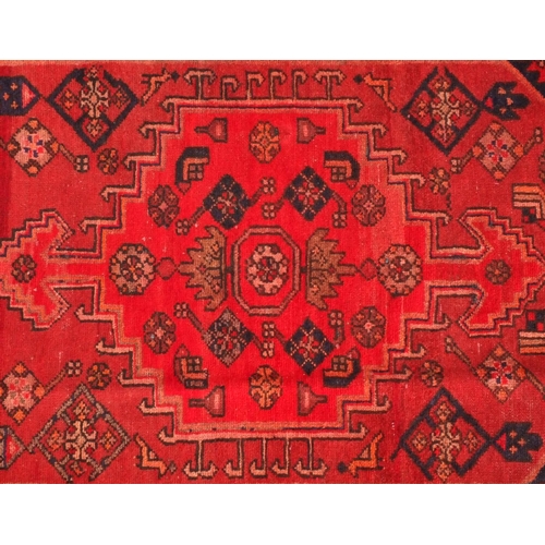 2067 - Rectangular Persian Hamadan rug, the central field and borders having all over floral motifs onto a ... 