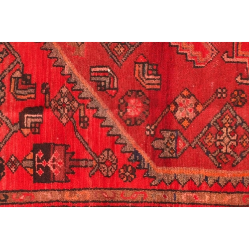 2067 - Rectangular Persian Hamadan rug, the central field and borders having all over floral motifs onto a ... 