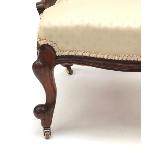 2028 - Victorian carved walnut ladies chair with cream button back upholstery 100cm high