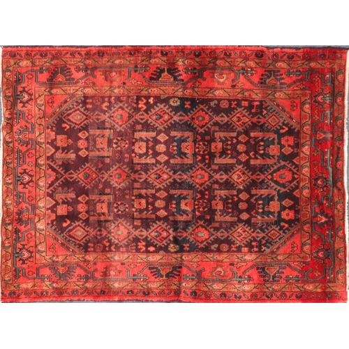 2045 - Rectangular Persian Hamadan rug, the central field having all over floral motifs, onto an red and pu... 