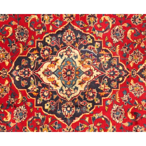 2025 - Rectangular Persian Bakhtiari rug, having all over floral motifs onto a predominantly red ground 208... 