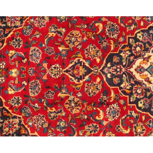 2025 - Rectangular Persian Bakhtiari rug, having all over floral motifs onto a predominantly red ground 208... 