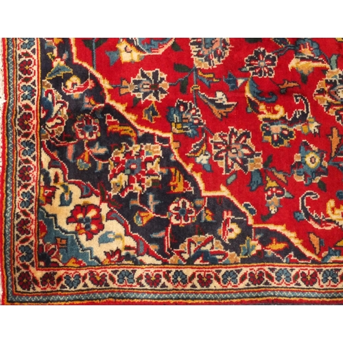 2025 - Rectangular Persian Bakhtiari rug, having all over floral motifs onto a predominantly red ground 208... 