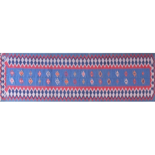 2088A - Antique rectangular Kilim carpet runner, having a geometric design on to a blue ground, 280cm x 85cm