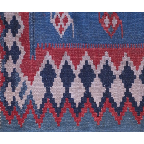 2088A - Antique rectangular Kilim carpet runner, having a geometric design on to a blue ground, 280cm x 85cm