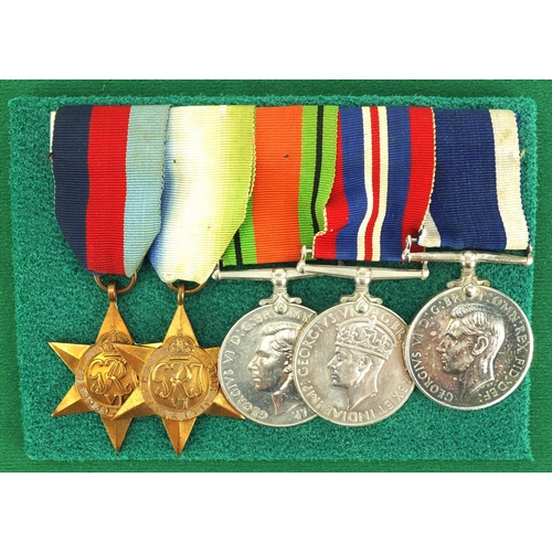 262 - British Military interest World War II medal group with miniatures, awarded to MX52817E.C.JONES.C.P.... 