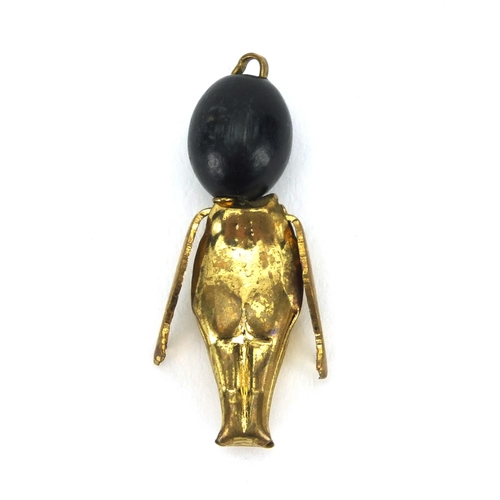 305 - Military interest gold coloured metal Fumsup lucky charm pendant, 3.1cm in length