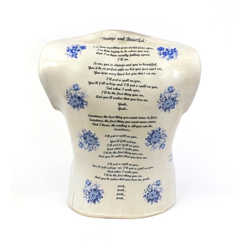 2106 - Decorative pottery torso, decorated with different mottos including 'the pleasure of love last a mom... 