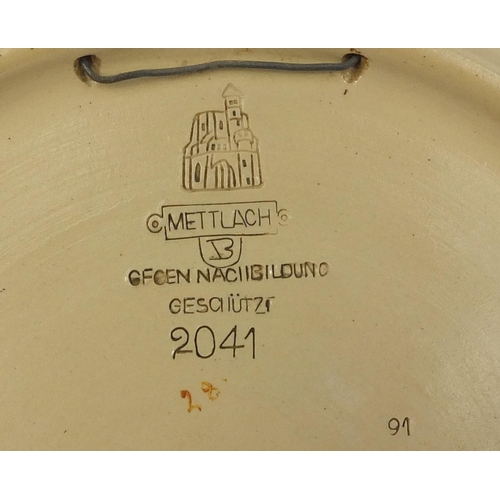 2198 - Mettlach pottery charger decorated with a huntsman and huntswoman, signed Stoikc dated '91, incised ... 