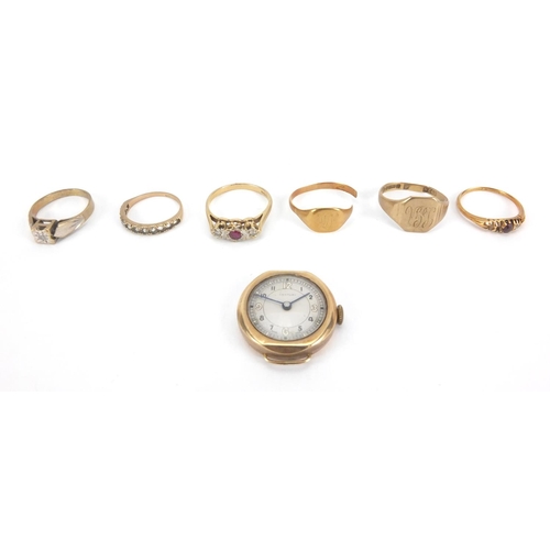 2605 - Six 18ct and 9ct gold rings, some set with stones and a 9ct gold wristwatch, approximate weight  23.... 